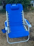 Rio Beach Folding Chair Blue W/ Headrest, Storage, Cup Holder & Backpack Straps. Fixed Price $30.00.