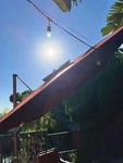 Red Rectangle Cantilever Patio Umbrella Fabric Canopy Crank Lift With Stand. Fixed Price $350.00.